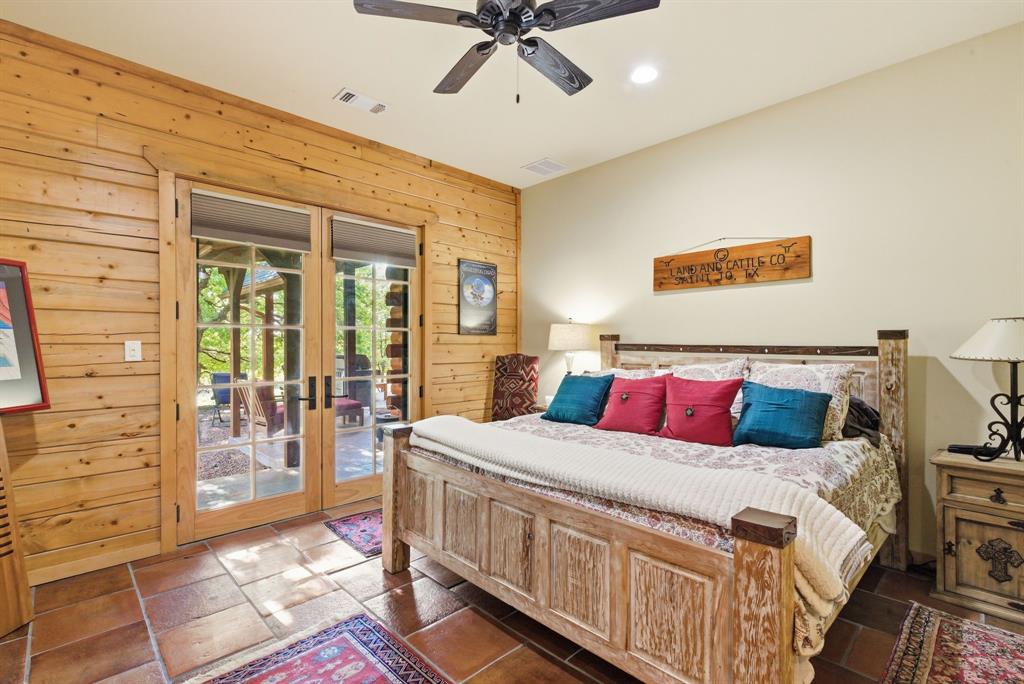 2197 Netherly Lane Forestburg, TX 76239 - Photo 12 of 40 a bedroom with a bed and a walk in closet
