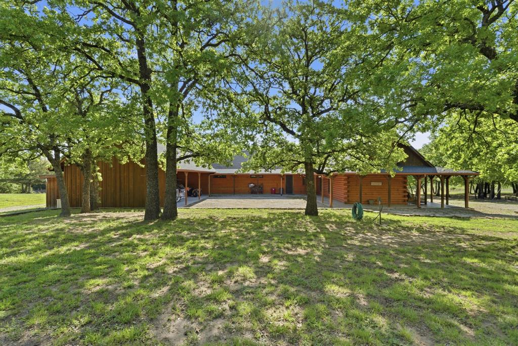 2197 Netherly Lane Forestburg, TX 76239 - Photo 16 of 40 a backyard of a house with lots of green space