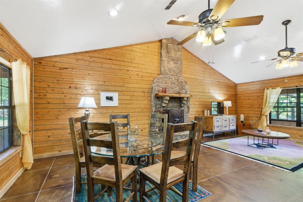 2197 Netherly Lane Forestburg, TX 76239 - Photo 20 of 40 a dining room with furniture and chandelier fan