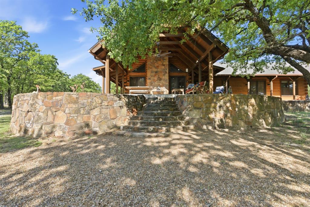 2197 Netherly Lane Forestburg, TX 76239 - Photo 2 of 40 a view of a house with a tree