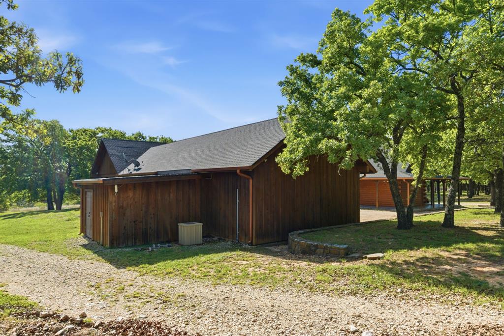 2197 Netherly Lane Forestburg, TX 76239 - Photo 22 of 40 a backyard of a house with lots of green space