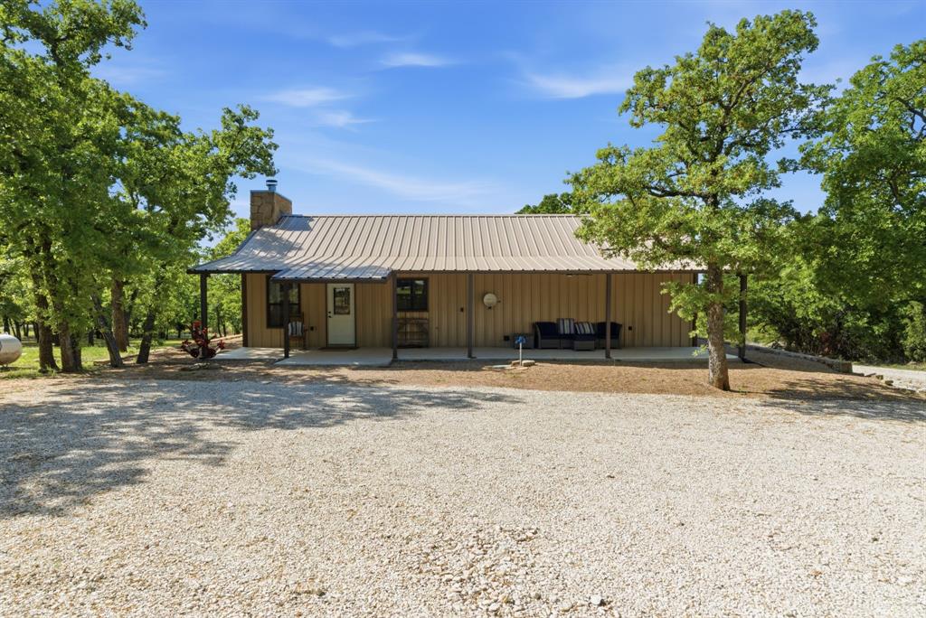 2197 Netherly Lane Forestburg, TX 76239 - Photo 24 of 40 a view of a house with a yard and sitting area