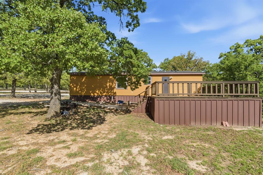 2197 Netherly Lane Forestburg, TX 76239 - Photo 29 of 40 a view of a yard with a tree