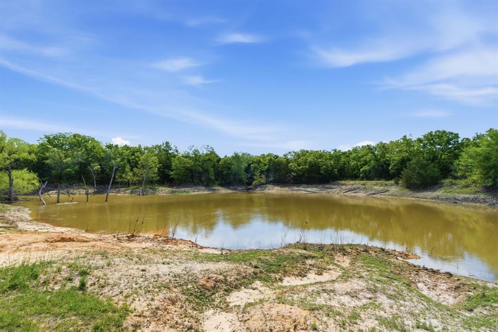 2197 Netherly Lane Forestburg, TX 76239 - Photo 39 of 40 a view of a lake with houses in the back