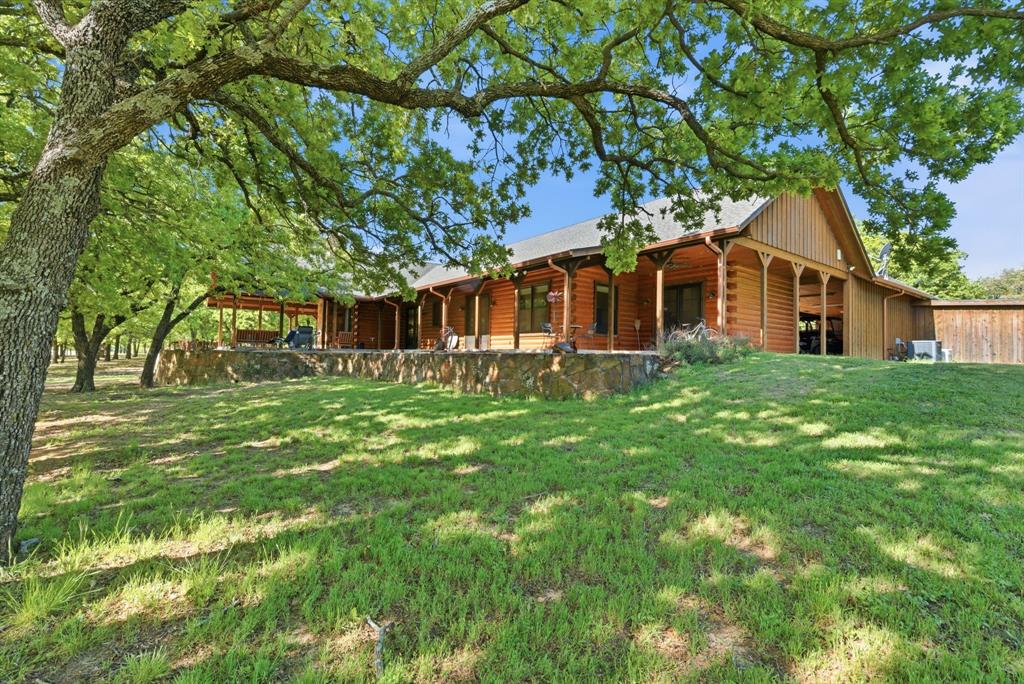 2197 Netherly Lane Forestburg, TX 76239 - Photo 6 of 40 a front view of a house with a garden