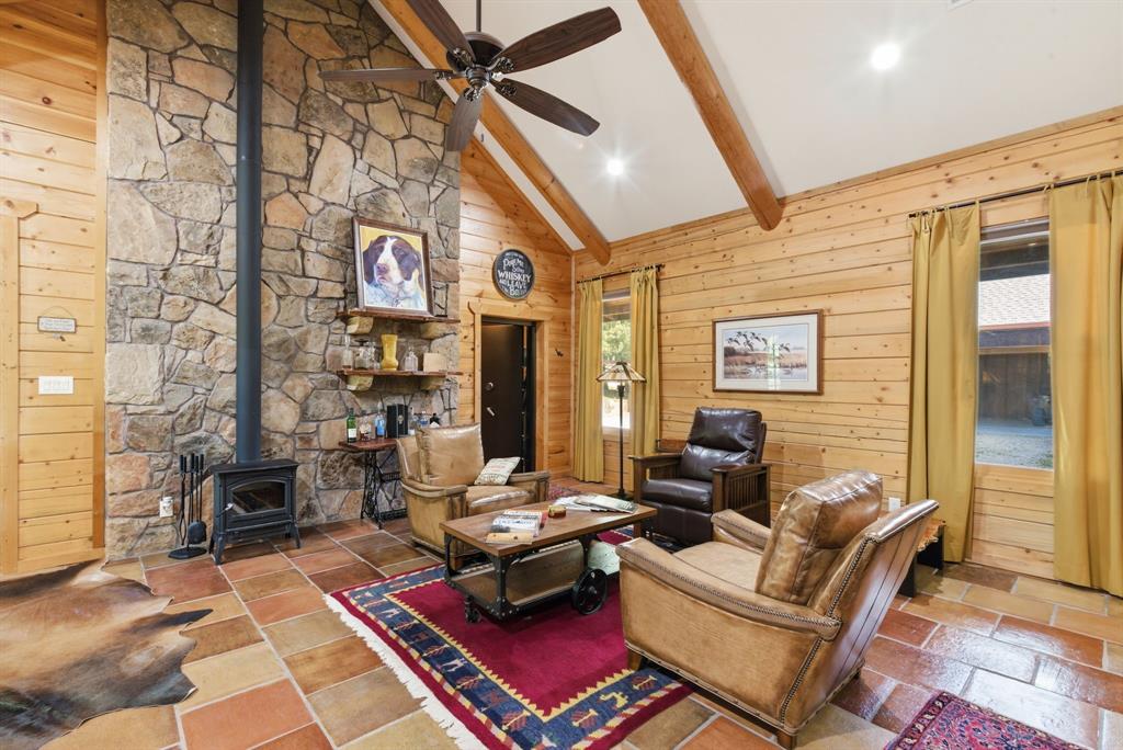 2197 Netherly Lane Forestburg, TX 76239 - Photo 8 of 40 a living room with furniture a rug and a table