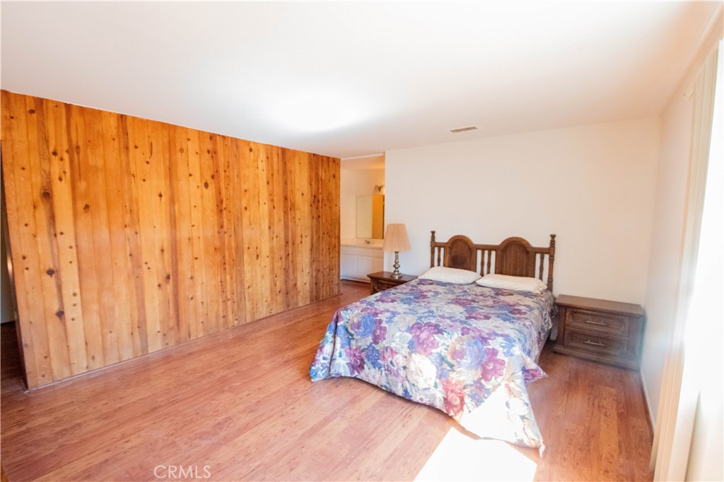 20135 Leadwell Street, Unit 2 Winnetka, CA 91306 - Photo 13 of 21 a bedroom with a bed and a window