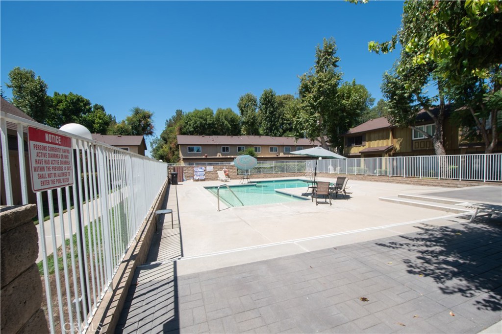 20135 Leadwell Street, Unit 2 Winnetka, CA 91306 - Photo 19 of 21 a view of a swimming pool with a patio