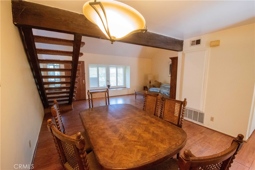 20135 Leadwell Street, Unit 2 Winnetka, CA 91306 - Photo 5 of 21 a view of a dining room with furniture and wooden floor