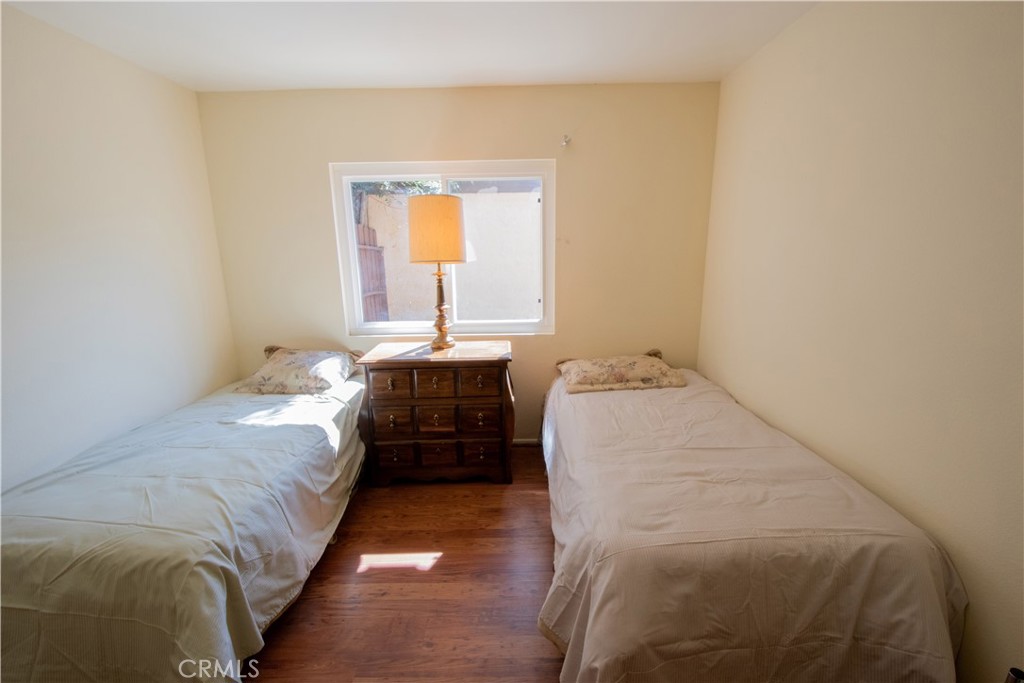 20135 Leadwell Street, Unit 2 Winnetka, CA 91306 - Photo 6 of 21 a bedroom with a bed and a window