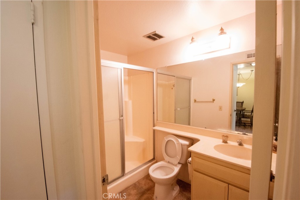 20135 Leadwell Street, Unit 2 Winnetka, CA 91306 - Photo 7 of 21 a bathroom with a sink a toilet and shower