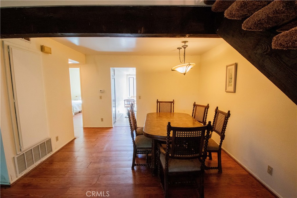 20135 Leadwell Street, Unit 2 Winnetka, CA 91306 - Photo 10 of 21 a view of a dining room with furniture and wooden floor