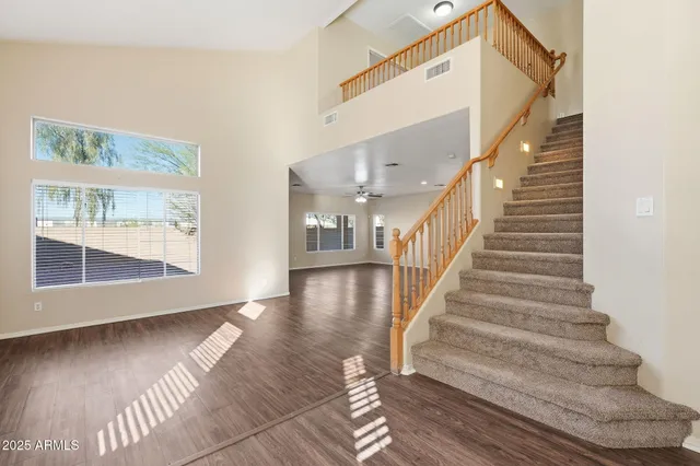 a bedroom with a bed and a potted plant