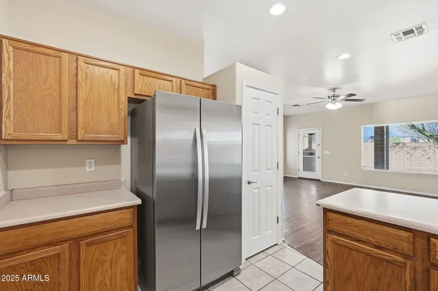 a kitchen with a sink a stove and cabinets