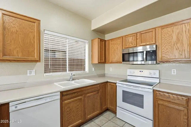 a kitchen with sink and window