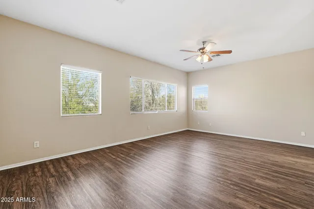 a kitchen with a refrigerator and a stove top oven