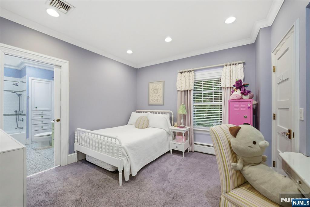 203 Heights Road Ridgewood, NJ 07450 - Photo 20 of 41 a spacious bedroom with a bed and wooden floor