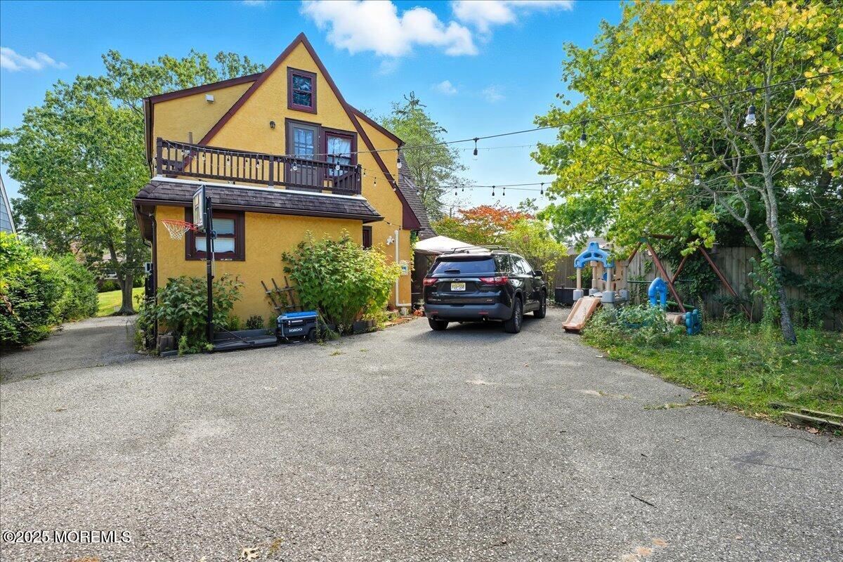 108 Pine Street Toms River, NJ 08753 - Photo 11 of 16 a car parked in front of house with a small yard