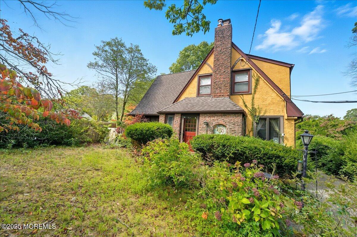 108 Pine Street Toms River, NJ 08753 - Photo 15 of 16 a front view of a house with a yard