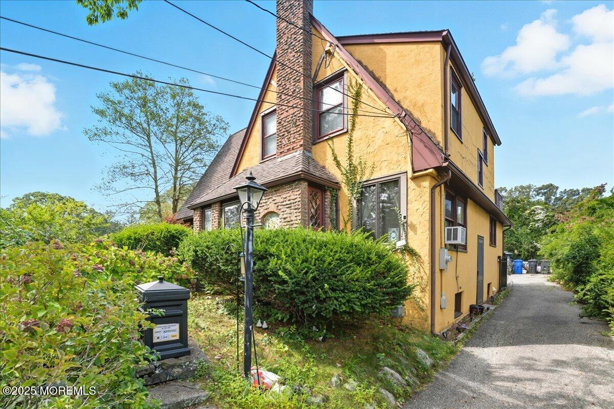 108 Pine Street Toms River, NJ 08753 - Photo 16 of 16 a yellow building with trees in front of it