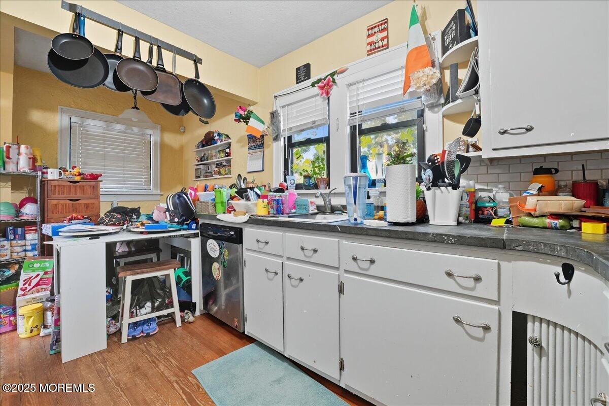108 Pine Street Toms River, NJ 08753 - Photo 3 of 16 a kitchen with stainless steel appliances granite countertop a sink and cabinets