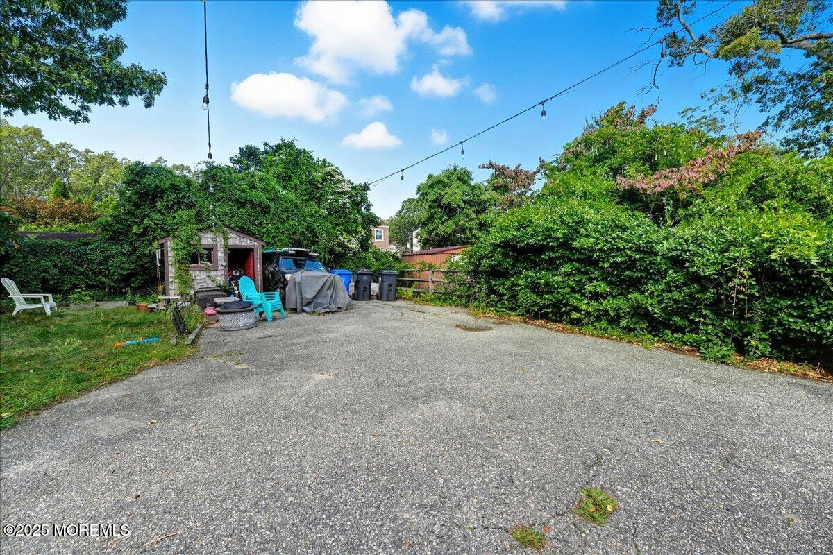 108 Pine Street Toms River, NJ 08753 - Photo 10 of 16 a view of a road with plants and a bench