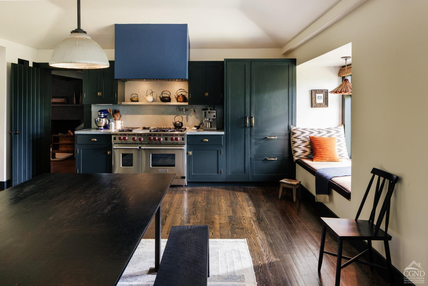 5280 Cauterskill Road Catskill, NY 12414 - Photo 11 of 55 a kitchen with a stove a refrigerator and chairs