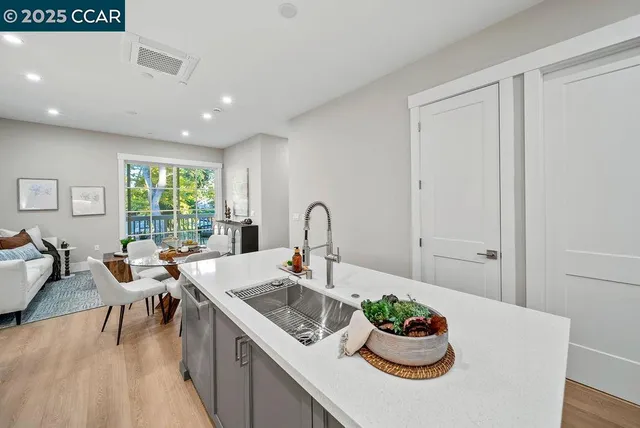a kitchen with a sink and breakfast area