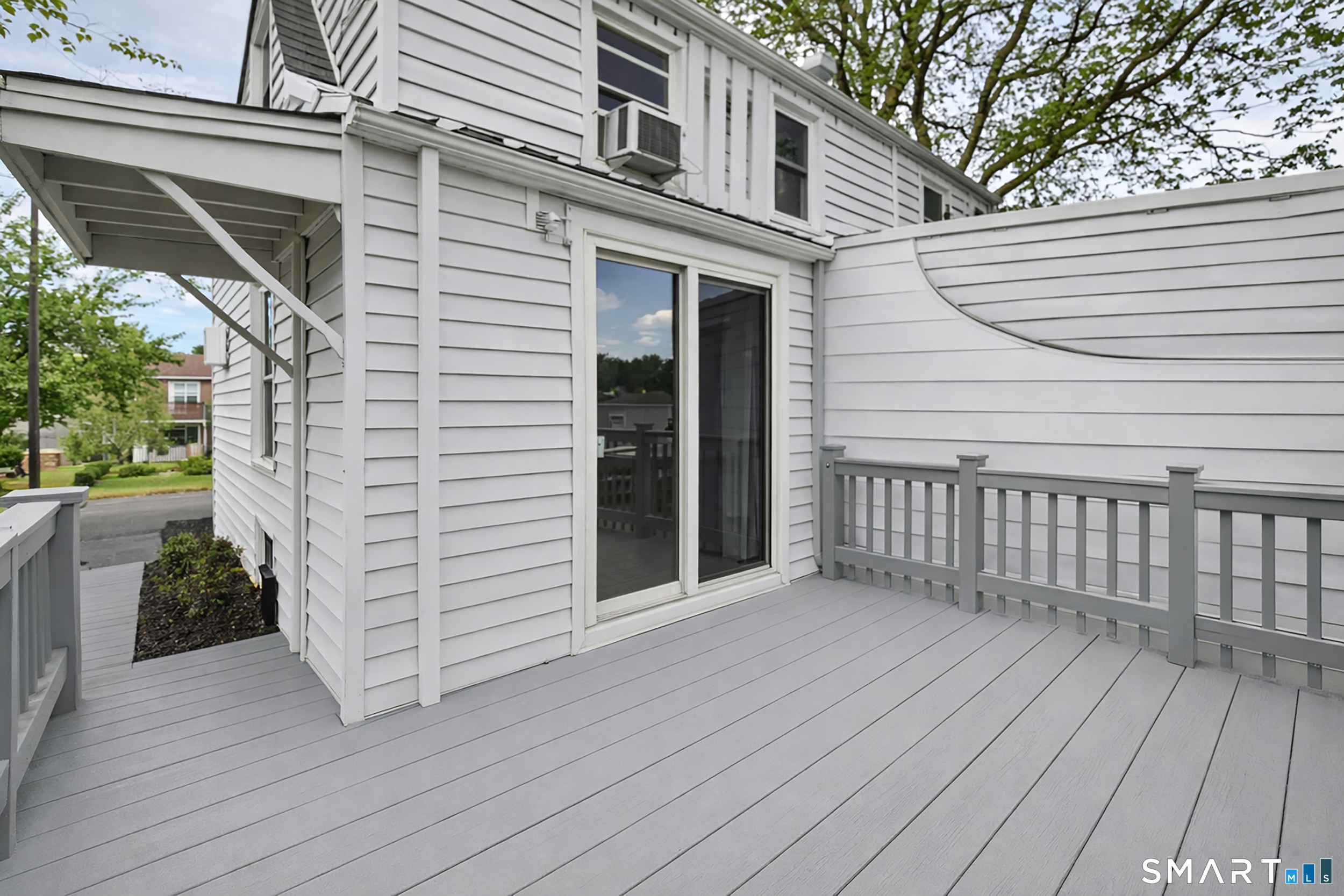 96 Campfield Road Manchester, CT 06040 - Photo 10 of 38 Rear wooden deck with a NEW slider from the Kitchen