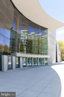 a large building with trees in front of it