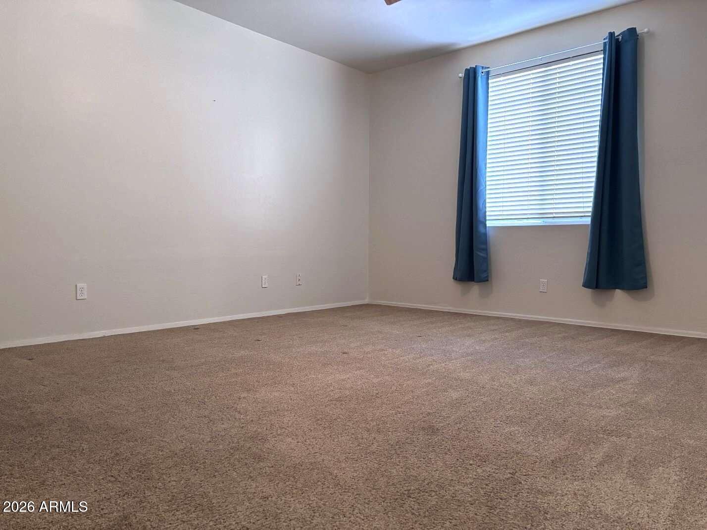 955 East Knox Road, Unit 118 Chandler, AZ 85225 - Photo 16 of 46 a view of an empty room with a window