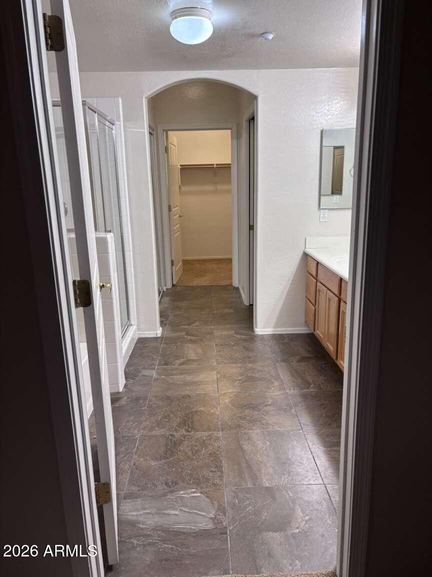 955 East Knox Road, Unit 118 Chandler, AZ 85225 - Photo 17 of 46 a view of a hallway with furniture and a gate