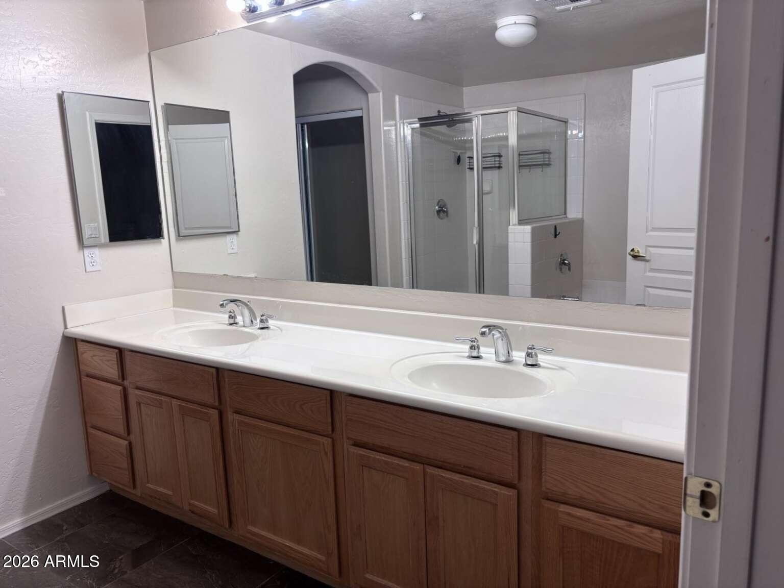 955 East Knox Road, Unit 118 Chandler, AZ 85225 - Photo 19 of 46 a bathroom with a double vanity sink and mirror