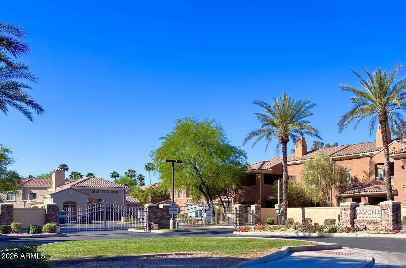955 East Knox Road, Unit 118 Chandler, AZ 85225 - Photo 2 of 50 a view of a swimming pool with a table and chairs