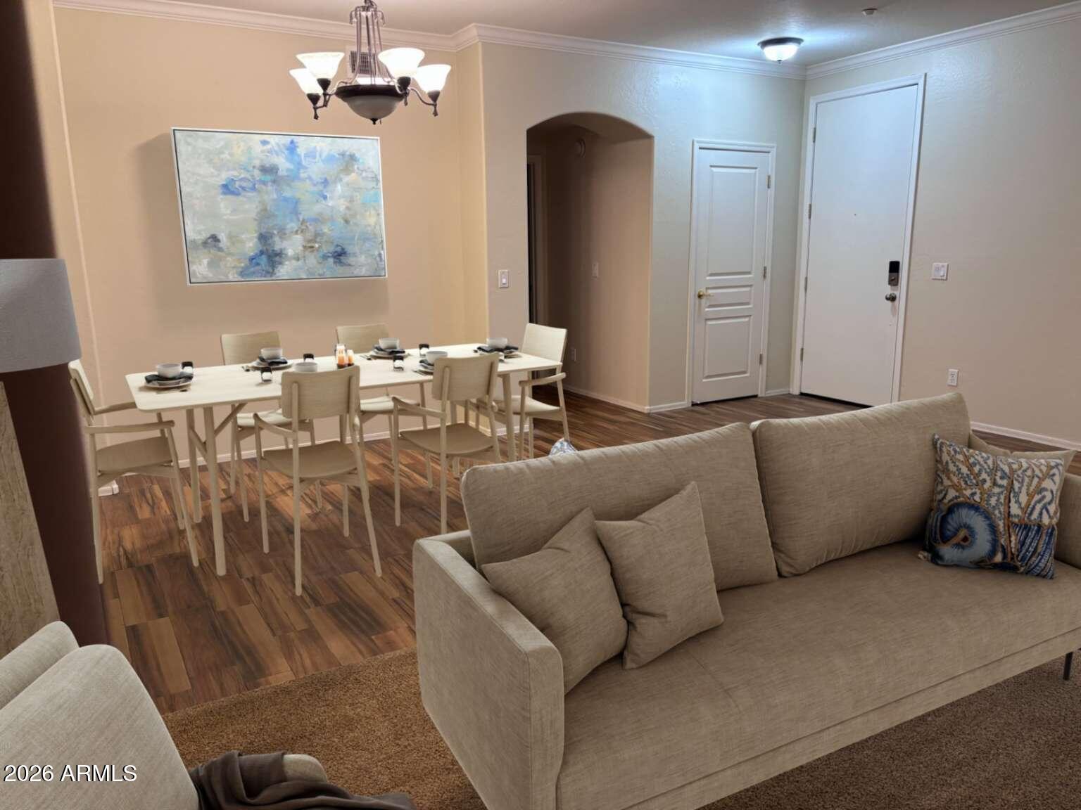 955 East Knox Road, Unit 118 Chandler, AZ 85225 - Photo 23 of 46 a living room with furniture wooden floor and a chandelier