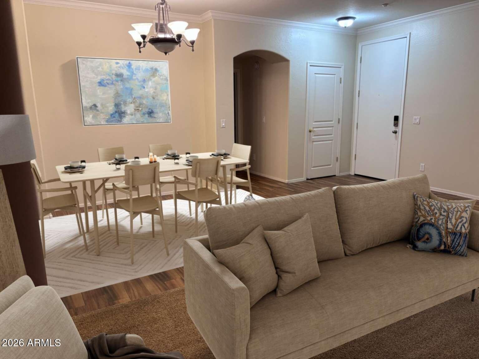 955 East Knox Road, Unit 118 Chandler, AZ 85225 - Photo 24 of 46 a living room with furniture kitchen view and a chandelier