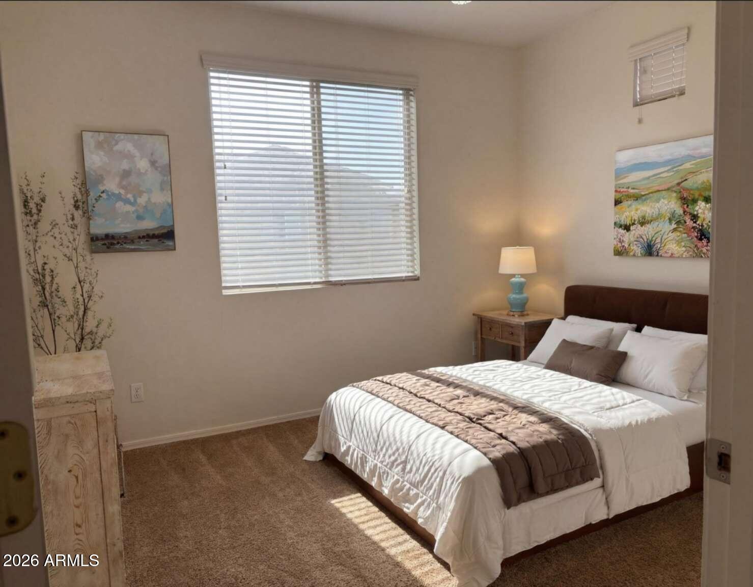 955 East Knox Road, Unit 118 Chandler, AZ 85225 - Photo 28 of 46 a bedroom with a bed and a window