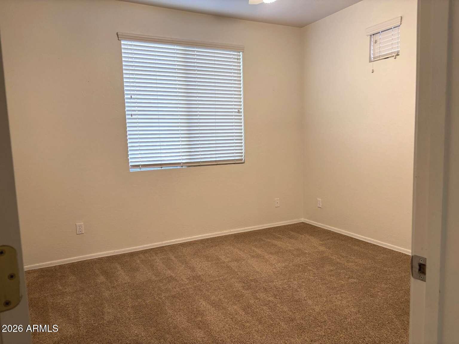955 East Knox Road, Unit 118 Chandler, AZ 85225 - Photo 29 of 46 an empty room with a window