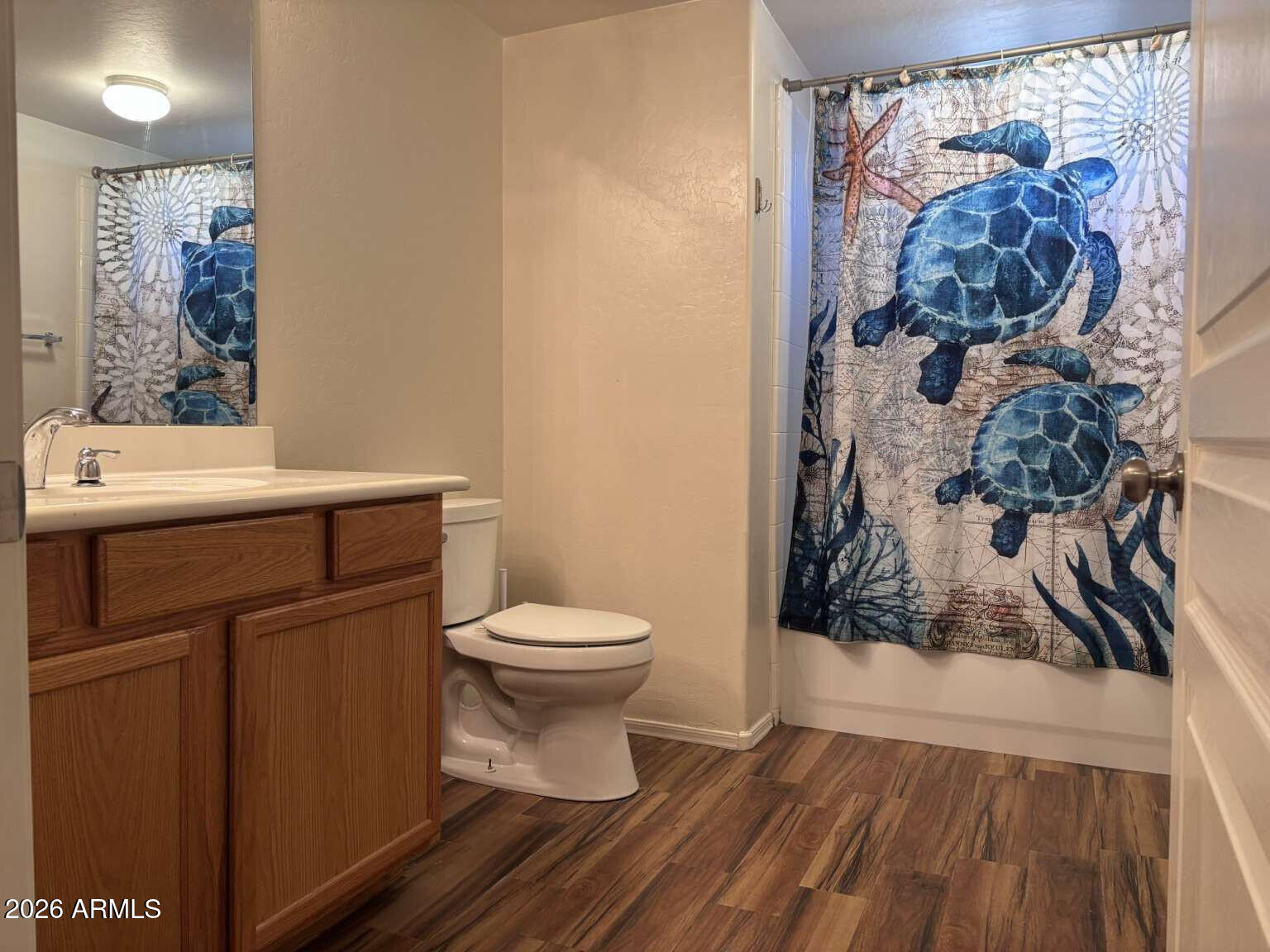 955 East Knox Road, Unit 118 Chandler, AZ 85225 - Photo 34 of 50 a bathroom with a toilet and a shower curtain