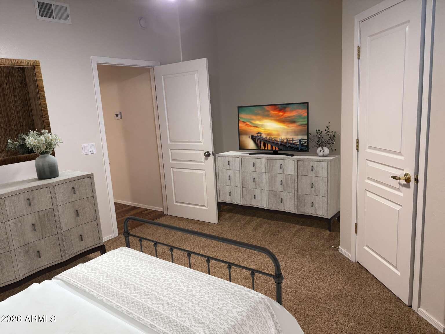 955 East Knox Road, Unit 118 Chandler, AZ 85225 - Photo 35 of 46 a bedroom with a bed and a flat screen tv