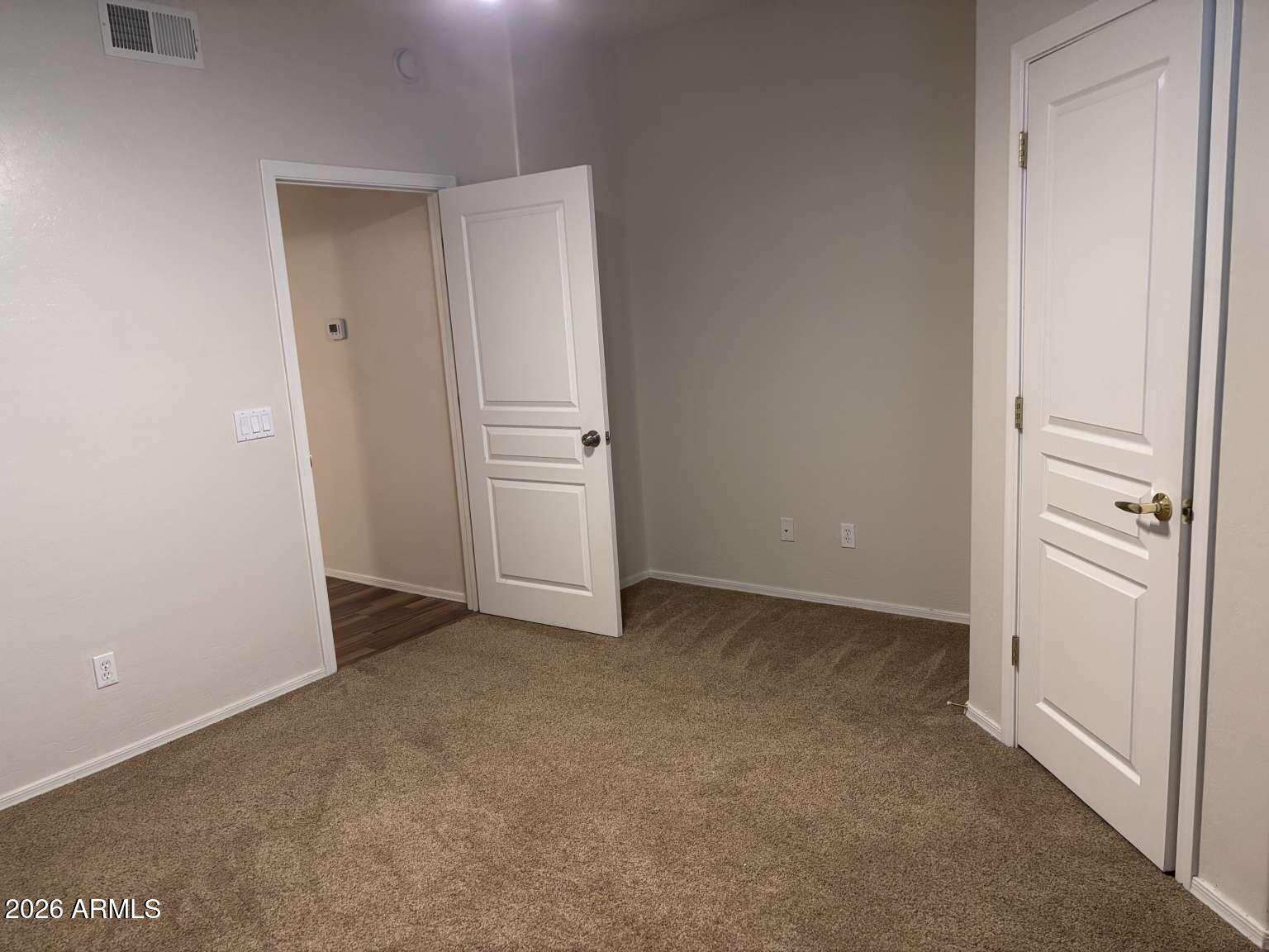 955 East Knox Road, Unit 118 Chandler, AZ 85225 - Photo 36 of 46 an empty room with closet area