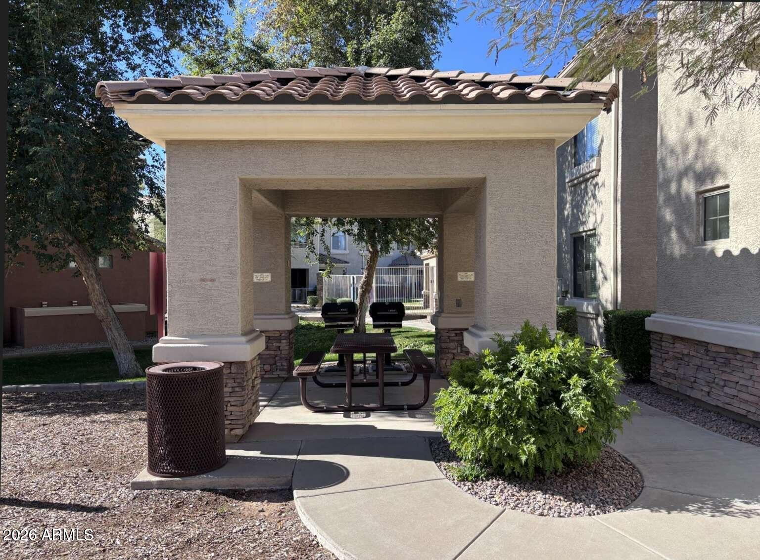 955 East Knox Road, Unit 118 Chandler, AZ 85225 - Photo 39 of 46 a view of a path along with potted plants