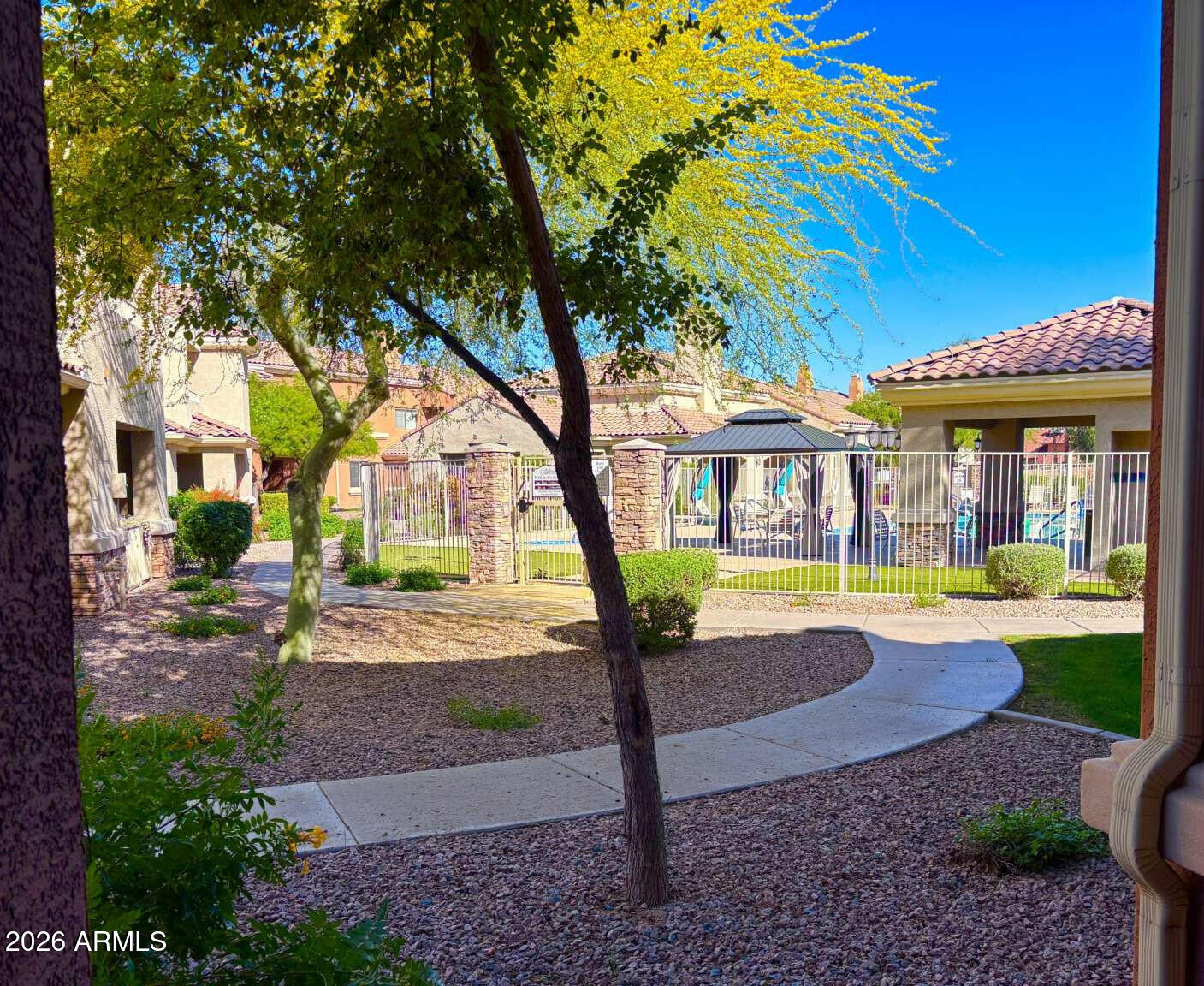 955 East Knox Road, Unit 118 Chandler, AZ 85225 - Photo 7 of 50 a view of a house with swimming pool and sitting area
