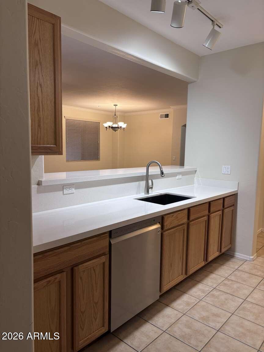 955 East Knox Road, Unit 118 Chandler, AZ 85225 - Photo 9 of 46 a sink with white cabinets