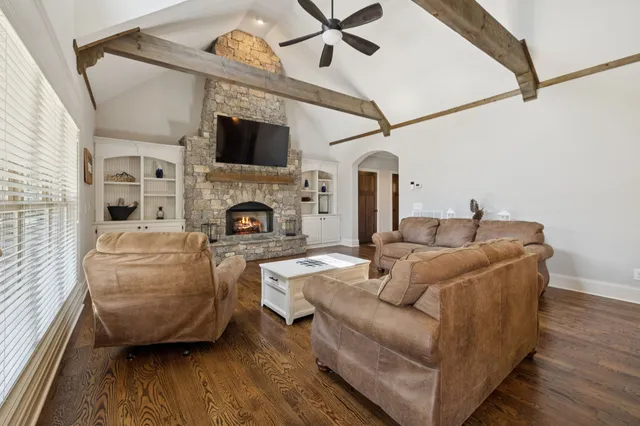 a large kitchen with stainless steel appliances lots of counter space and a sink