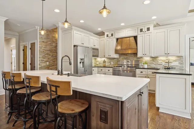 a view of a backyard with a small cabin and wooden fence