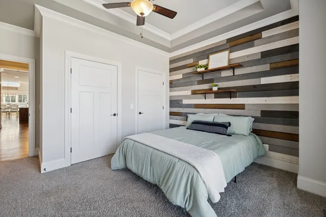 a bed room with a bed and a television