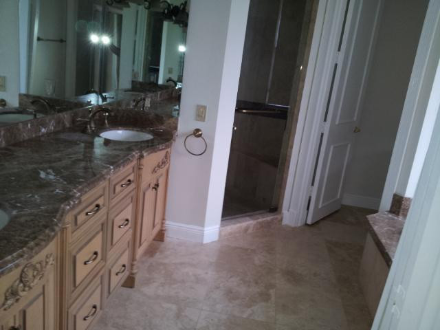 772 Parkside Circle North Boca Raton, FL 33486 - Photo 5 of 10 a bathroom with a double vanity sink and a mirror