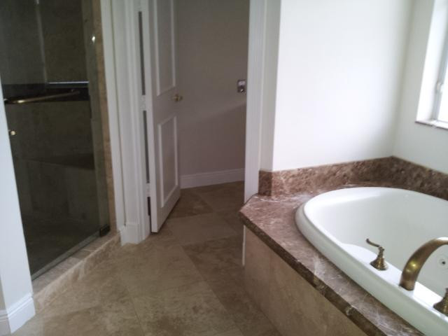 772 Parkside Circle North Boca Raton, FL 33486 - Photo 6 of 10 a bathroom with a tub and shower