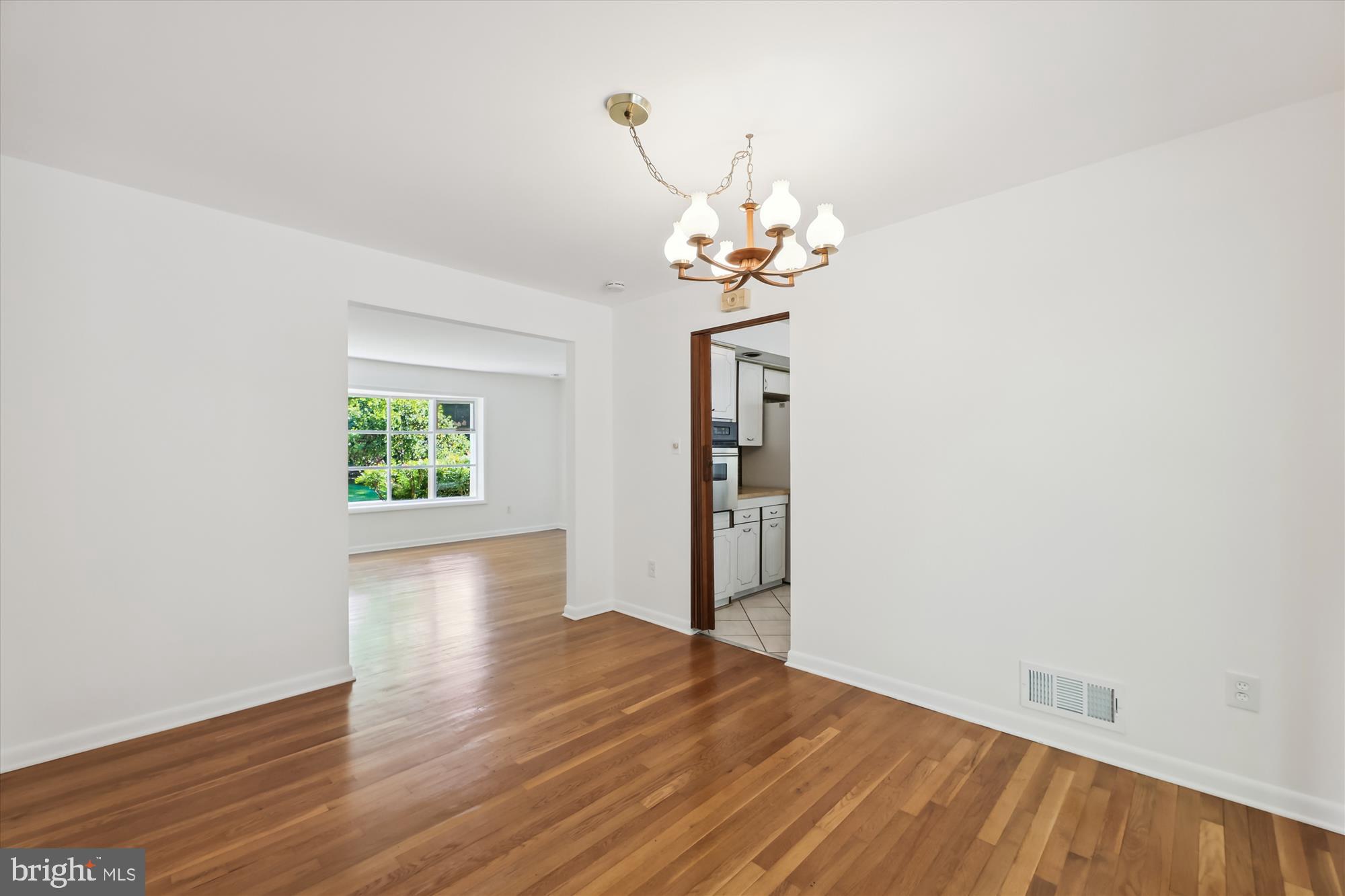 11616 Lovejoy Street Silver Spring, MD 20902 - Photo 11 of 72 Dining room to living room, access to kitchen.